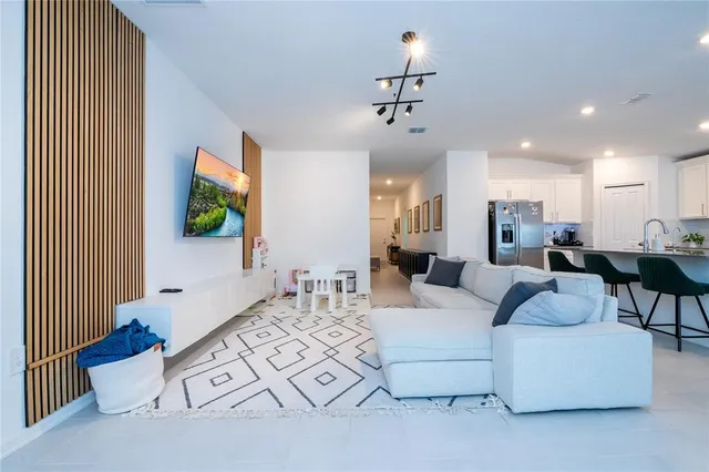 a view of living room with a bath tub and windows