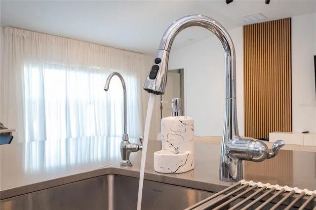 a kitchen with cabinets a sink and appliances