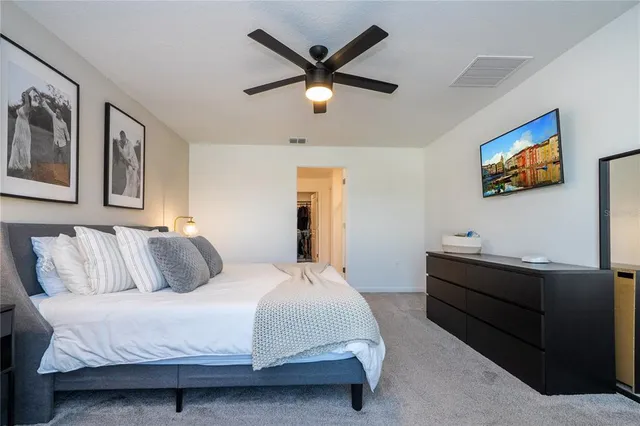 an aerial view of a house with a yard swimming pool and outdoor seating