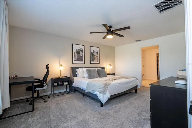 an aerial view of residential houses with outdoor space and swimming pool