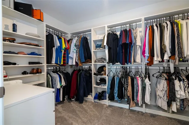 a view of a back yard of the house with a patio