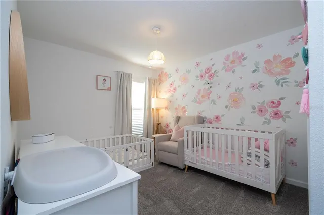 a view of a white house with a outdoor space