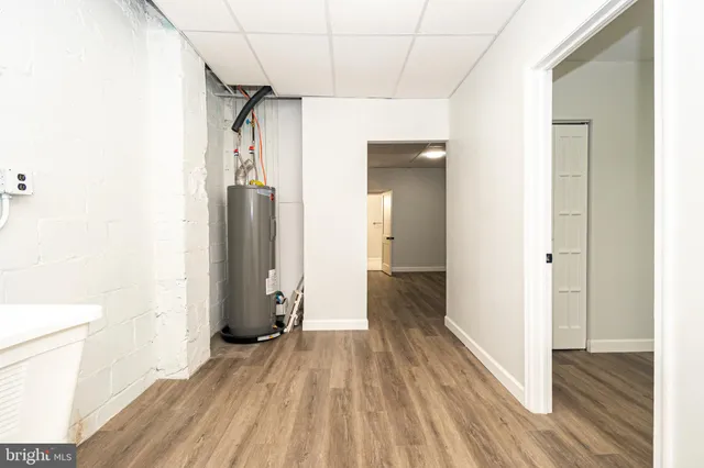 a view of bathroom with a toilet a sink and a mirror