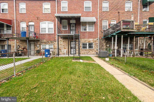 a view of a building with a yard