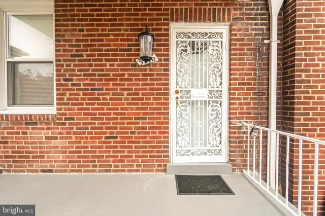 a view of a brick buildings with large windows