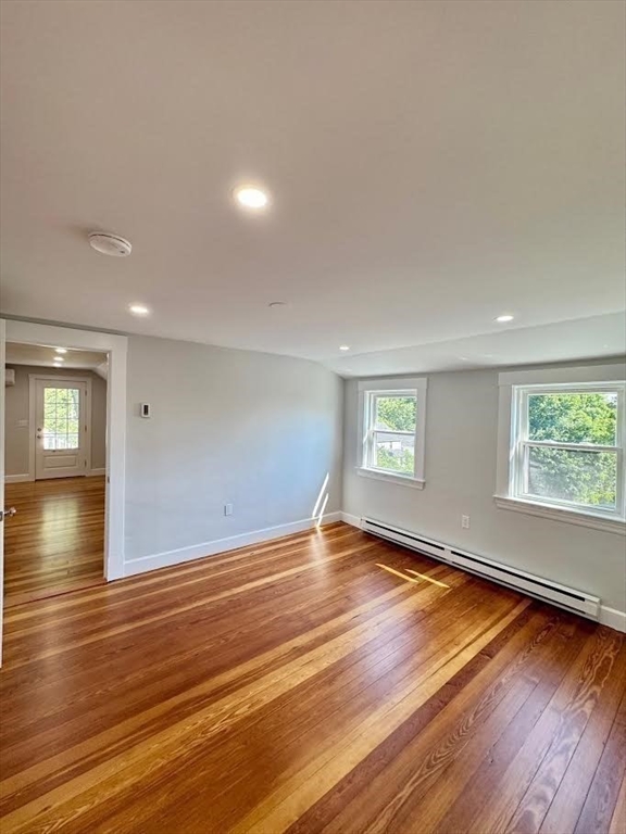 37 Fountain Road Arlington, MA 02476 - Photo 11 of 28 a view of an empty room with wooden floor and a window