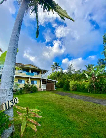 a view of a house with a big yard