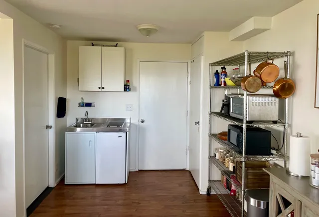 a kitchen with stainless steel appliances a stove and a refrigerator