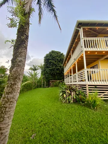 a view of a dry yard with mountains in the background