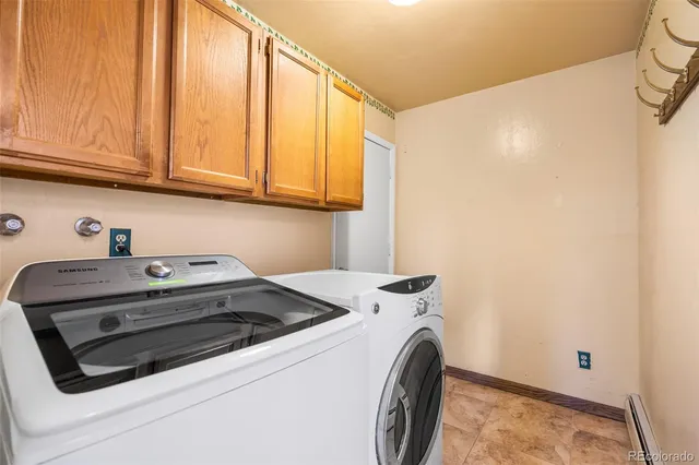 a bathroom with a bathtub shower and a sink