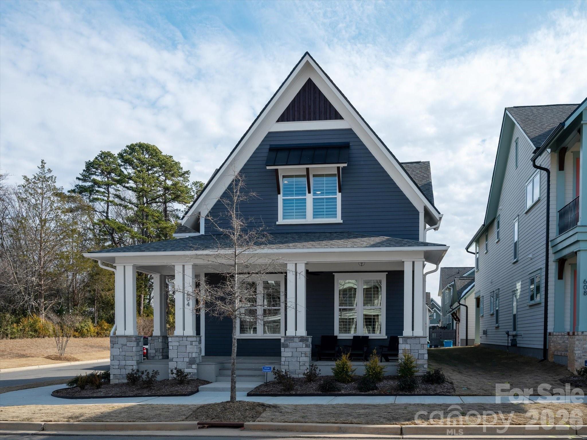 604 Hops Alley Fort Mill, SC 29715 - Photo 2 of 48 a front view of a house with garden