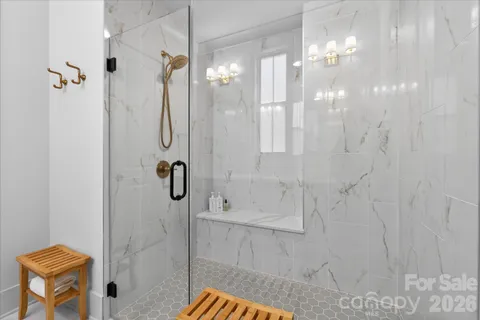 a kitchen with stainless steel appliances granite countertop a sink a stove and a wooden floors