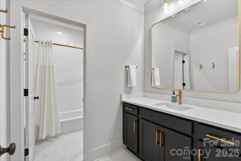 a bathroom with a bathtub and shower