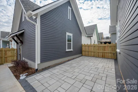 a view of a terrace with a wooden fence