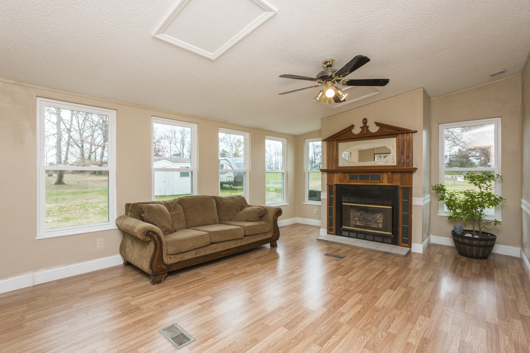 2930 Ray W Road Springfield, TN 37172 - Photo 11 of 25 a living room with furniture a fireplace and a window