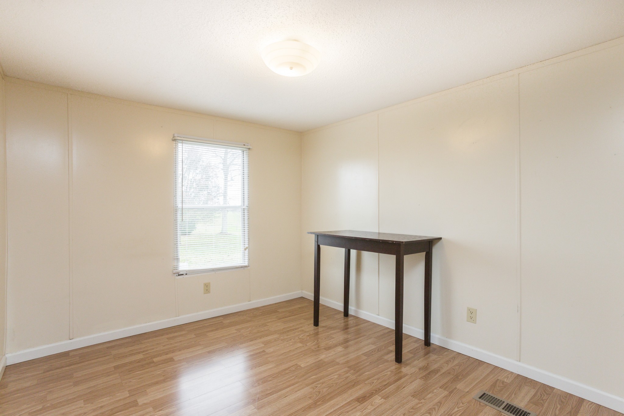 2930 Ray W Road Springfield, TN 37172 - Photo 20 of 25 an empty room with wooden floor and windows
