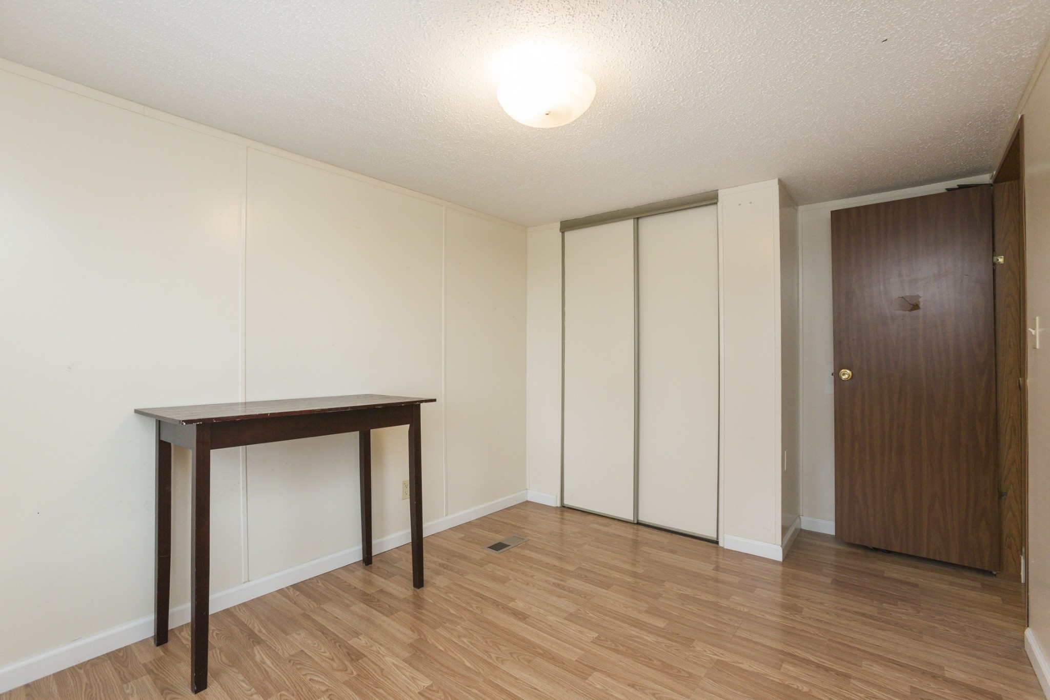 2930 Ray W Road Springfield, TN 37172 - Photo 21 of 25 a view of an empty room with wooden floor and a window