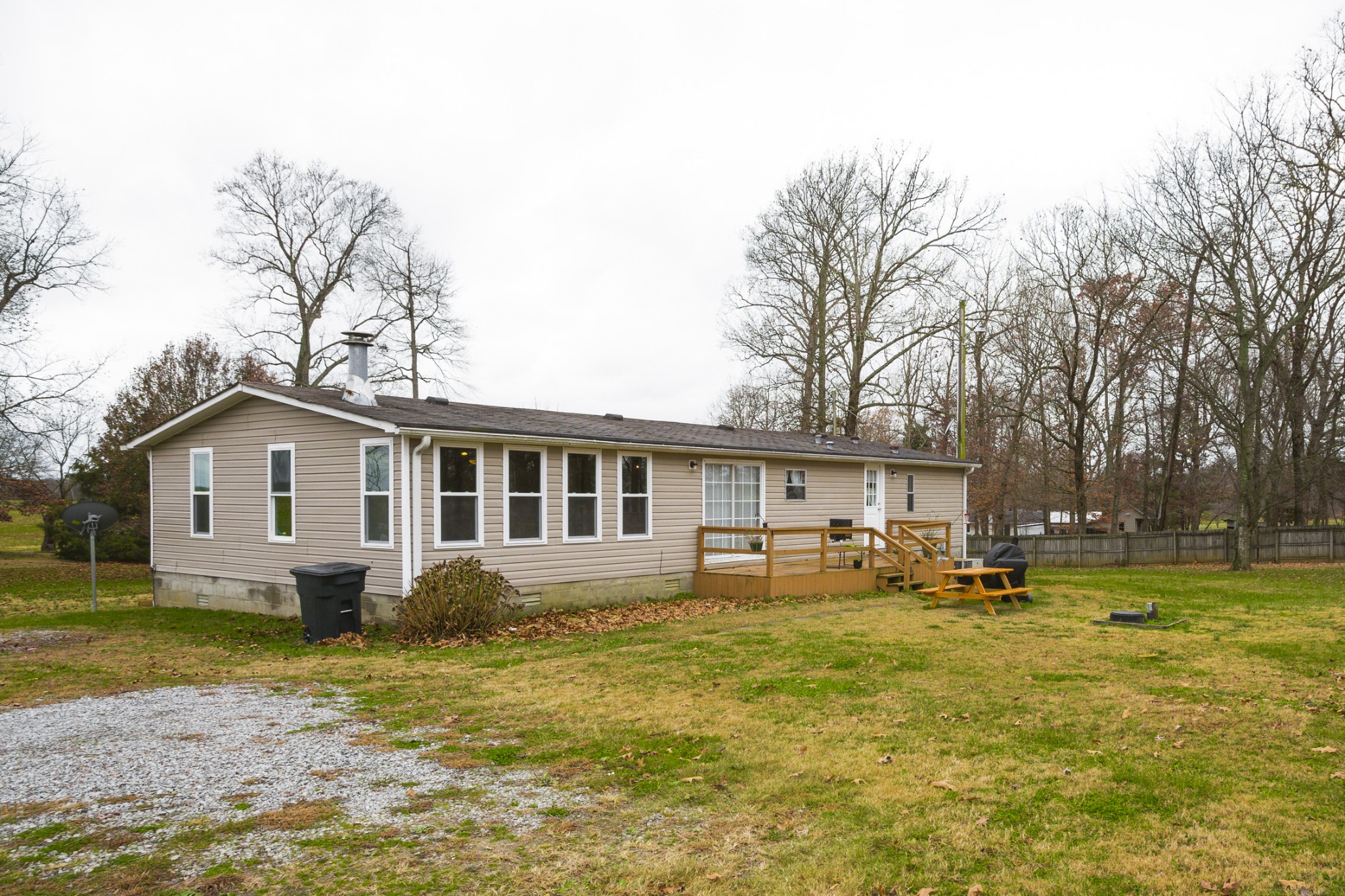 2930 Ray W Road Springfield, TN 37172 - Photo 22 of 25 a front view of a house with a garden and trees