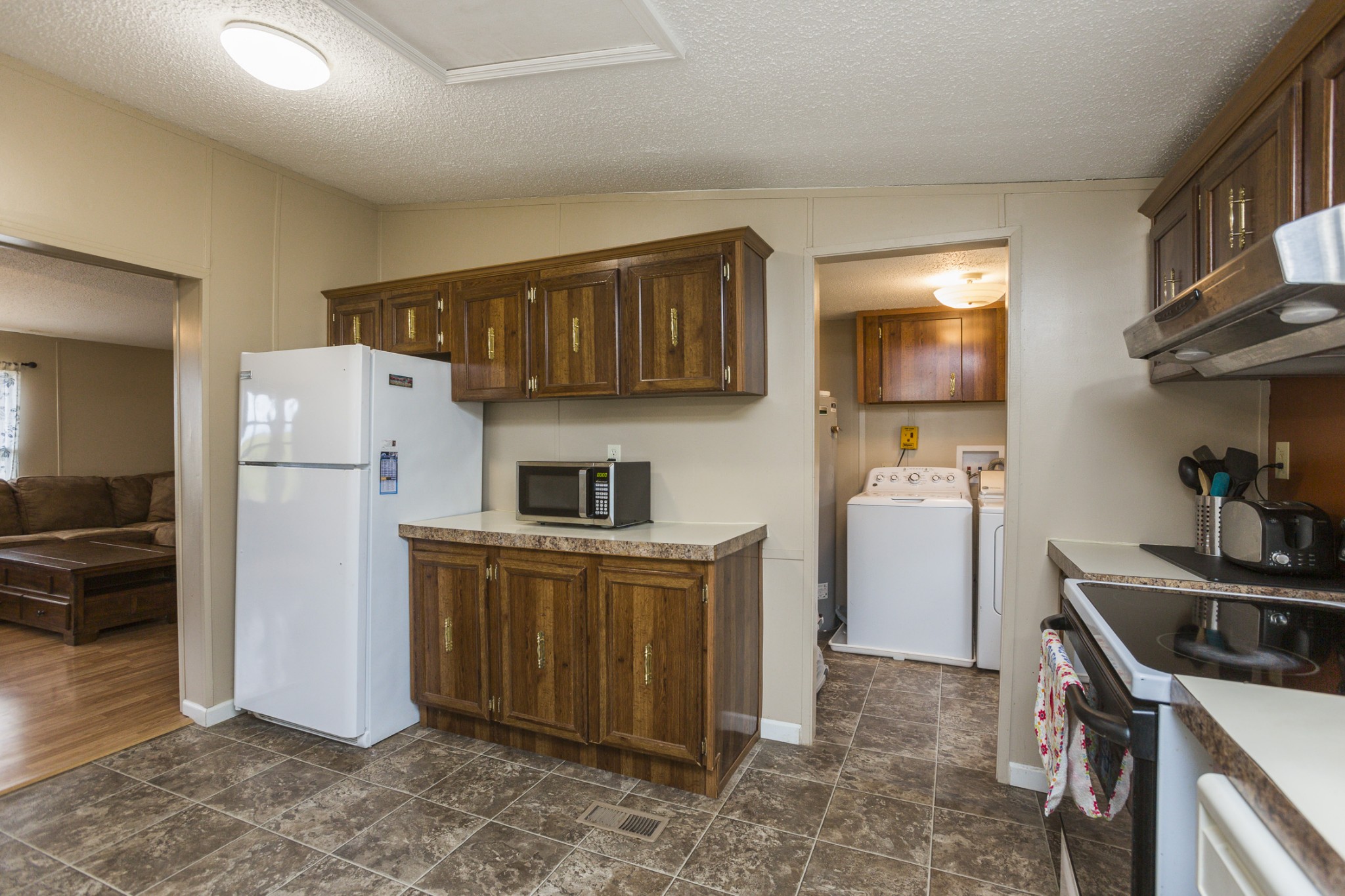 2930 Ray W Road Springfield, TN 37172 - Photo 5 of 25 a kitchen with refrigerator and cabinets