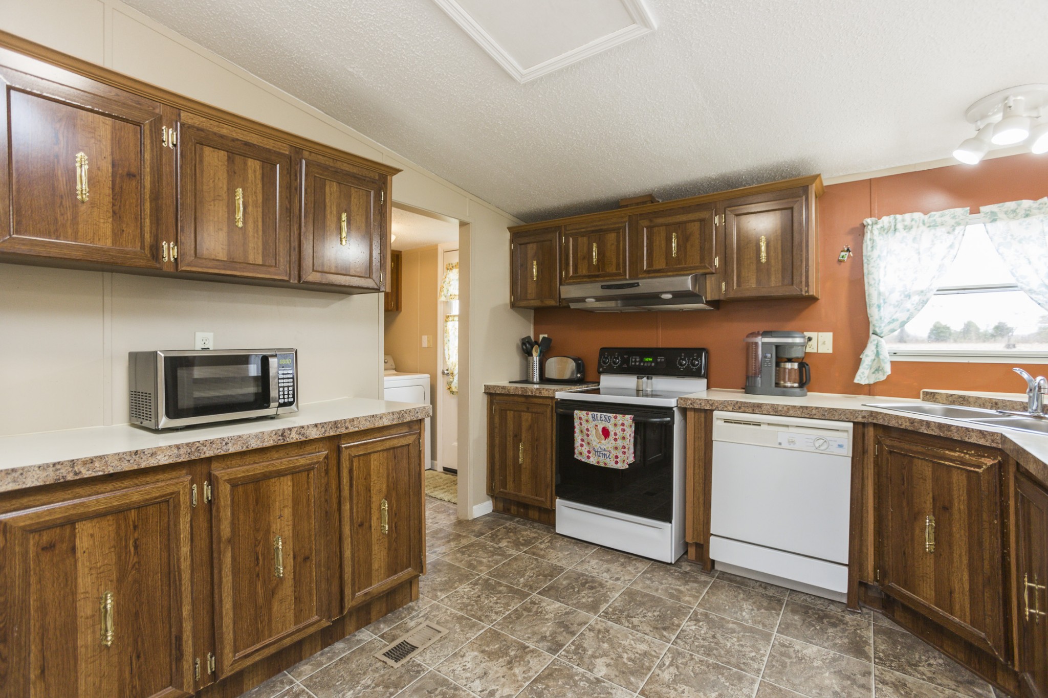 2930 Ray W Road Springfield, TN 37172 - Photo 7 of 25 a kitchen with stainless steel appliances granite countertop a stove sink microwave and cabinets