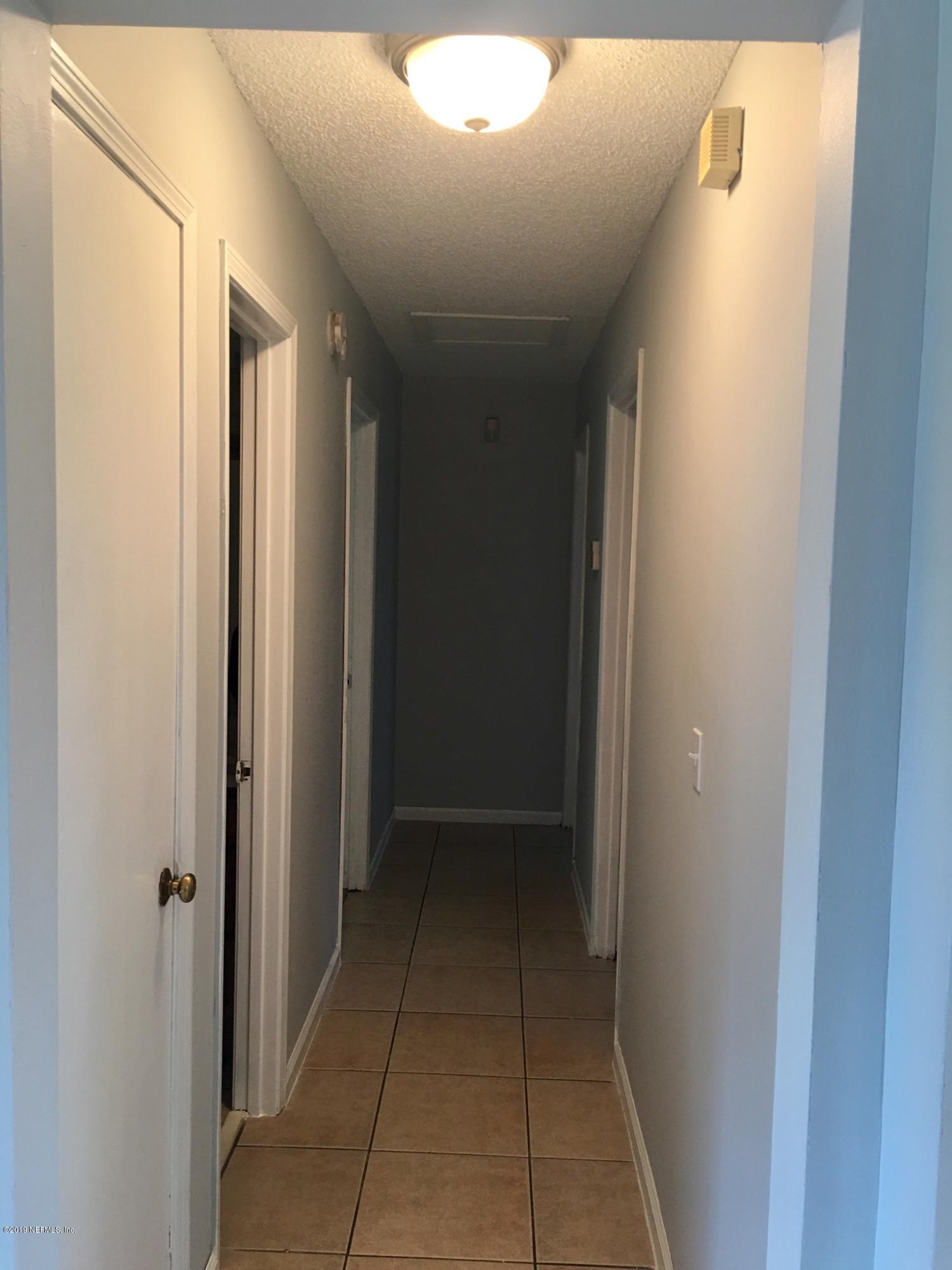 8224 Pear Road Jacksonville, FL 32210 - Photo 7 of 7 a view of hallway with shower