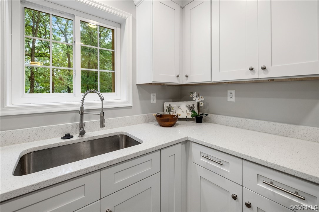 1104 Duckbill Court Midlothian, VA 23113 - Photo 12 of 29 a kitchen with white cabinets and a sink