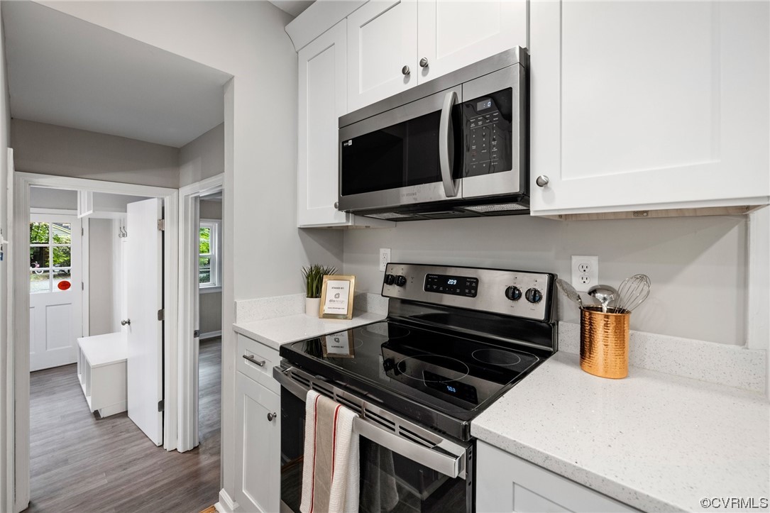 1104 Duckbill Court Midlothian, VA 23113 - Photo 13 of 29 a kitchen with a stove and a microwave