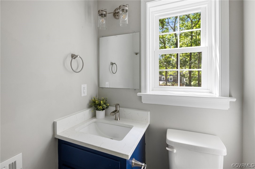 1104 Duckbill Court Midlothian, VA 23113 - Photo 14 of 29 a bathroom with a sink a toilet and a window