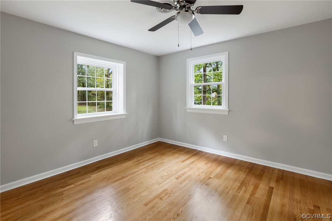 1104 Duckbill Court Midlothian, VA 23113 - Photo 22 of 29 a view of an empty room with wooden floor and a window