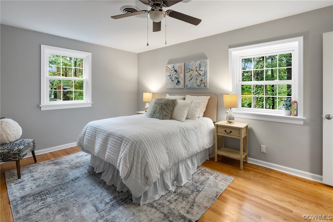 1104 Duckbill Court Midlothian, VA 23113 - Photo 23 of 29 a bedroom with a bed and a chandelier