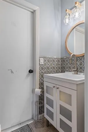 a view of a hallway with closet and front door