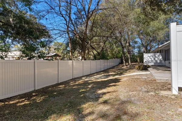 a view of a yard with a tree