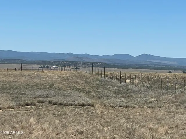 a view of a car is parked in front of a building