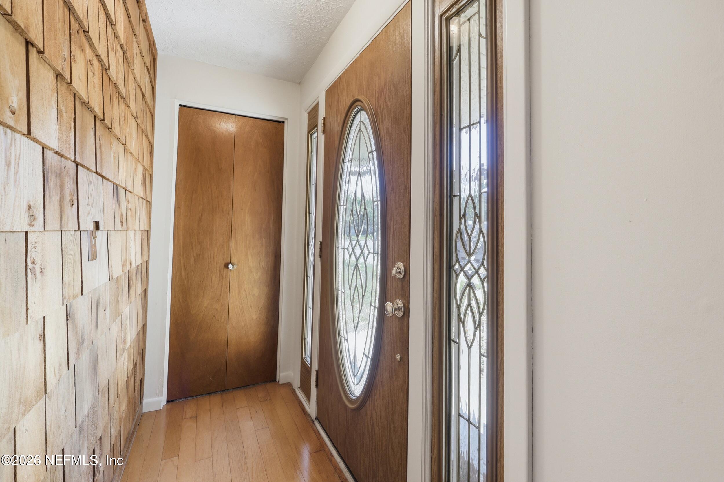 a view of a entryway with wooden floor