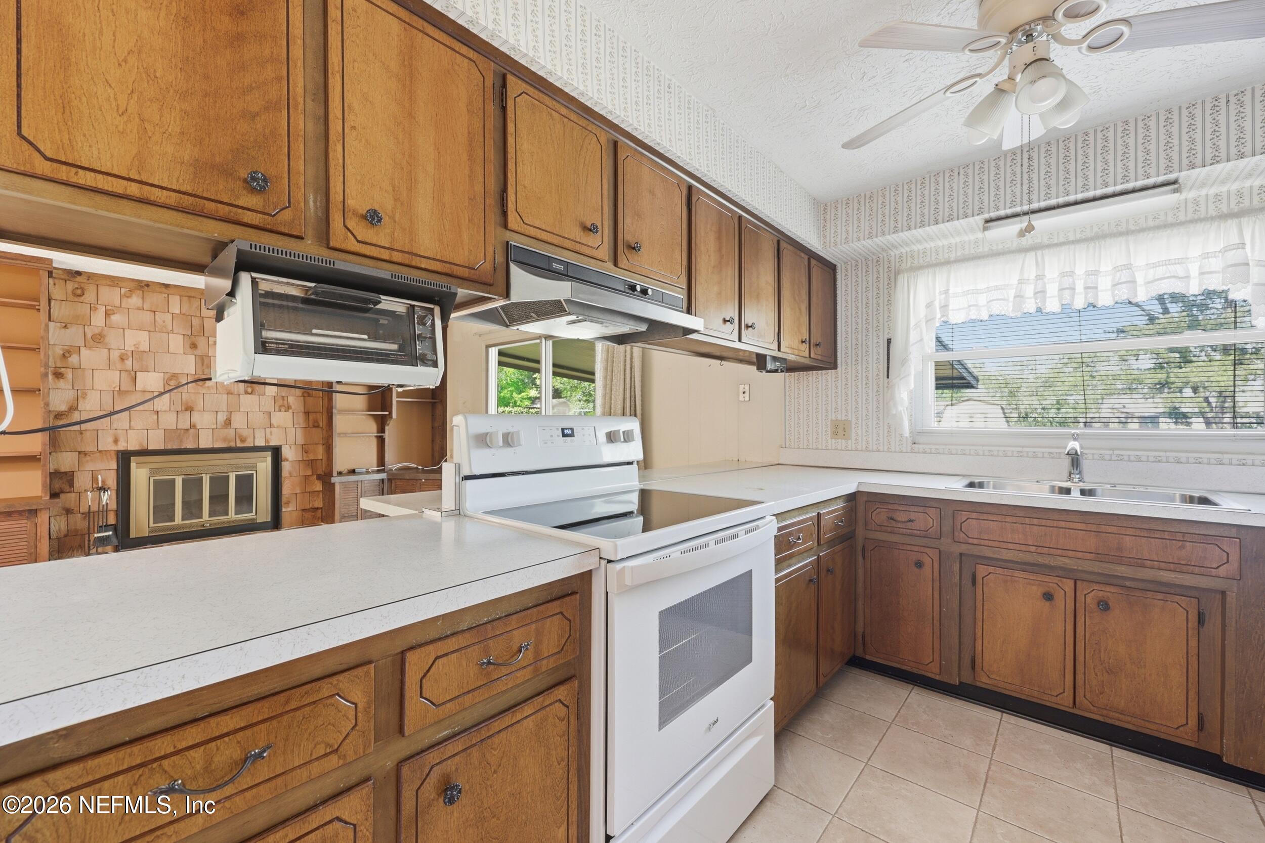 3519 Peoria Road Orange Park, FL 32065 - Photo 11 of 43 a kitchen with a sink cabinets and window