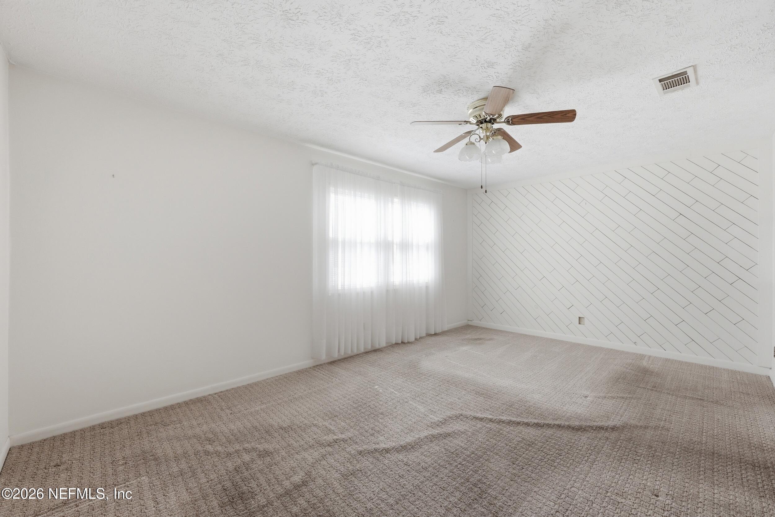 3519 Peoria Road Orange Park, FL 32065 - Photo 20 of 43 an empty room with windows and fan