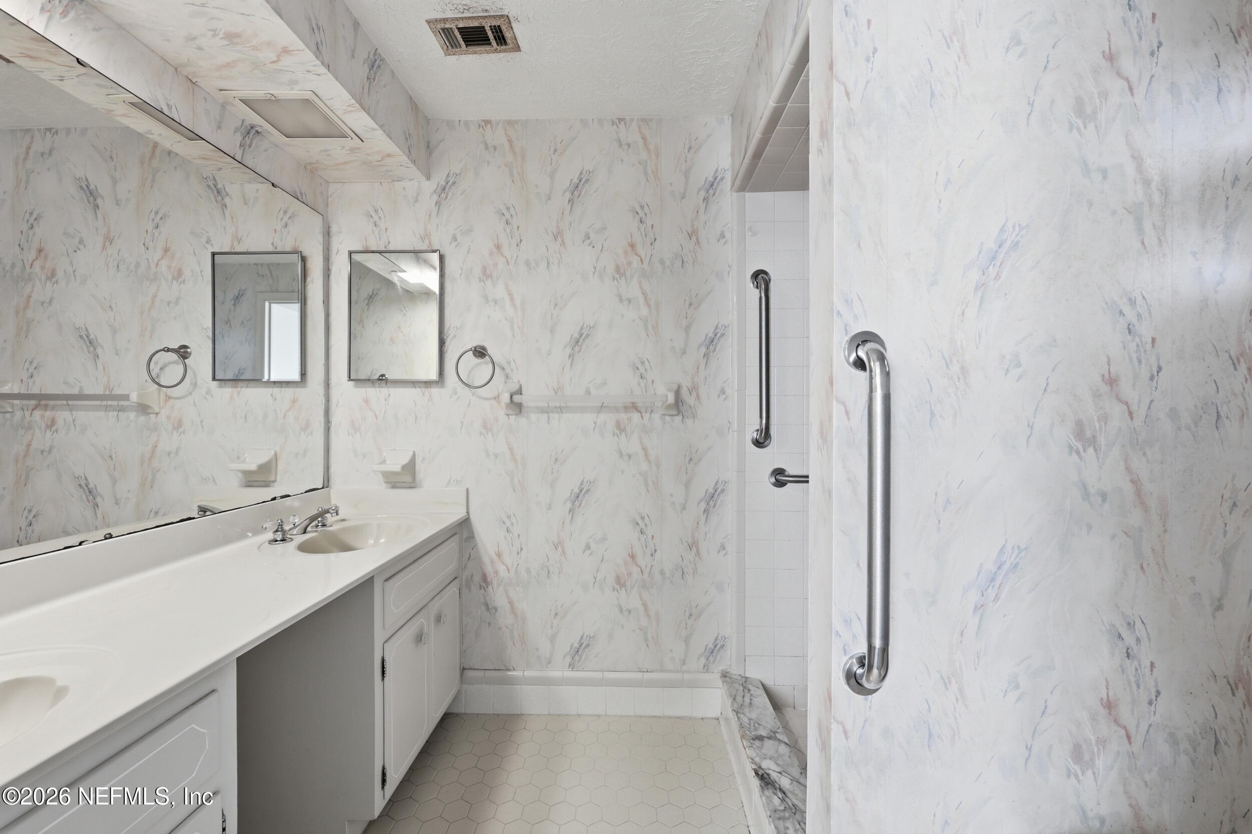 3519 Peoria Road Orange Park, FL 32065 - Photo 22 of 43 a bathroom with a sink a toilet and shower