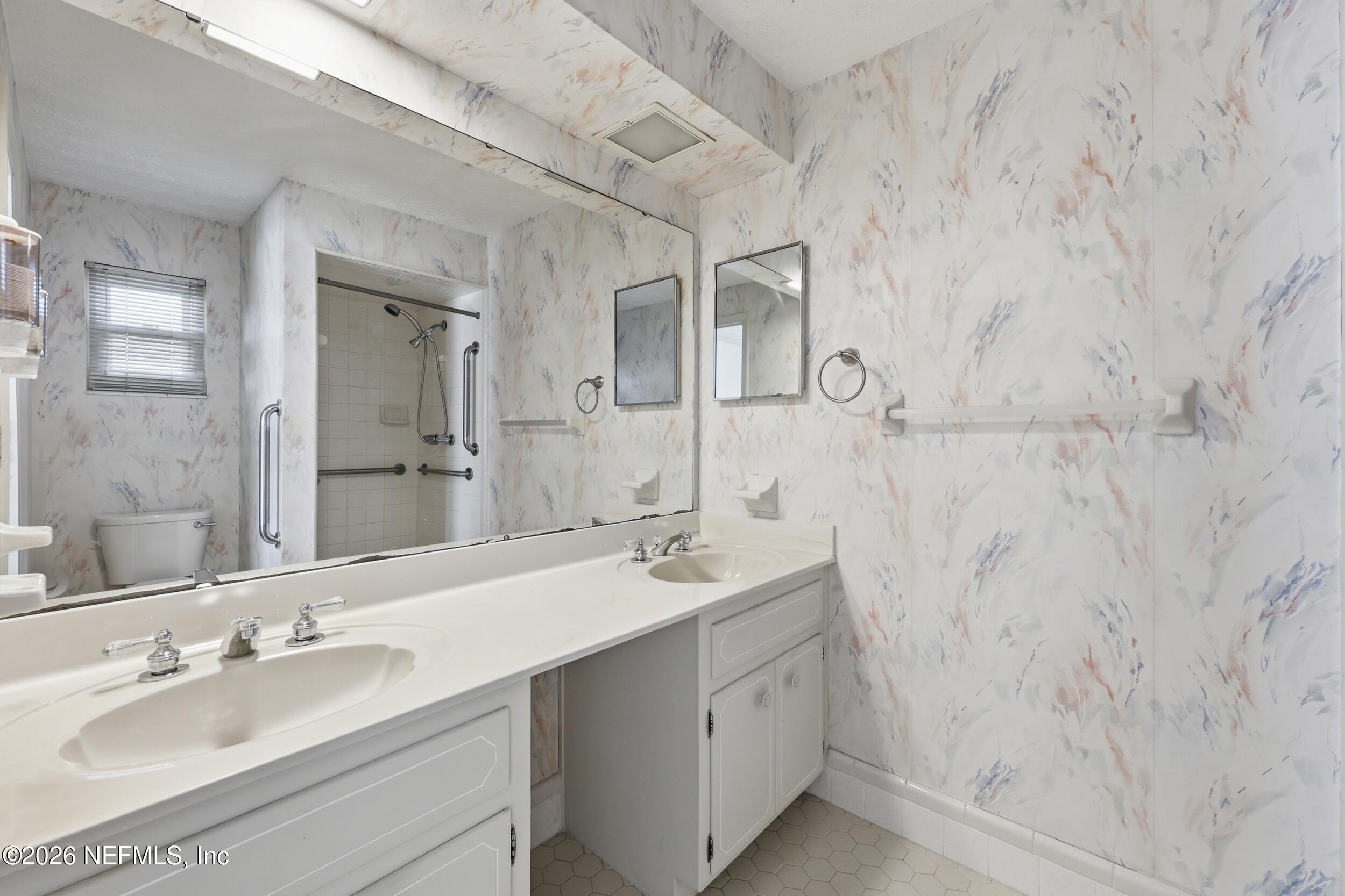 3519 Peoria Road Orange Park, FL 32065 - Photo 23 of 43 a bathroom with a sink and a mirror