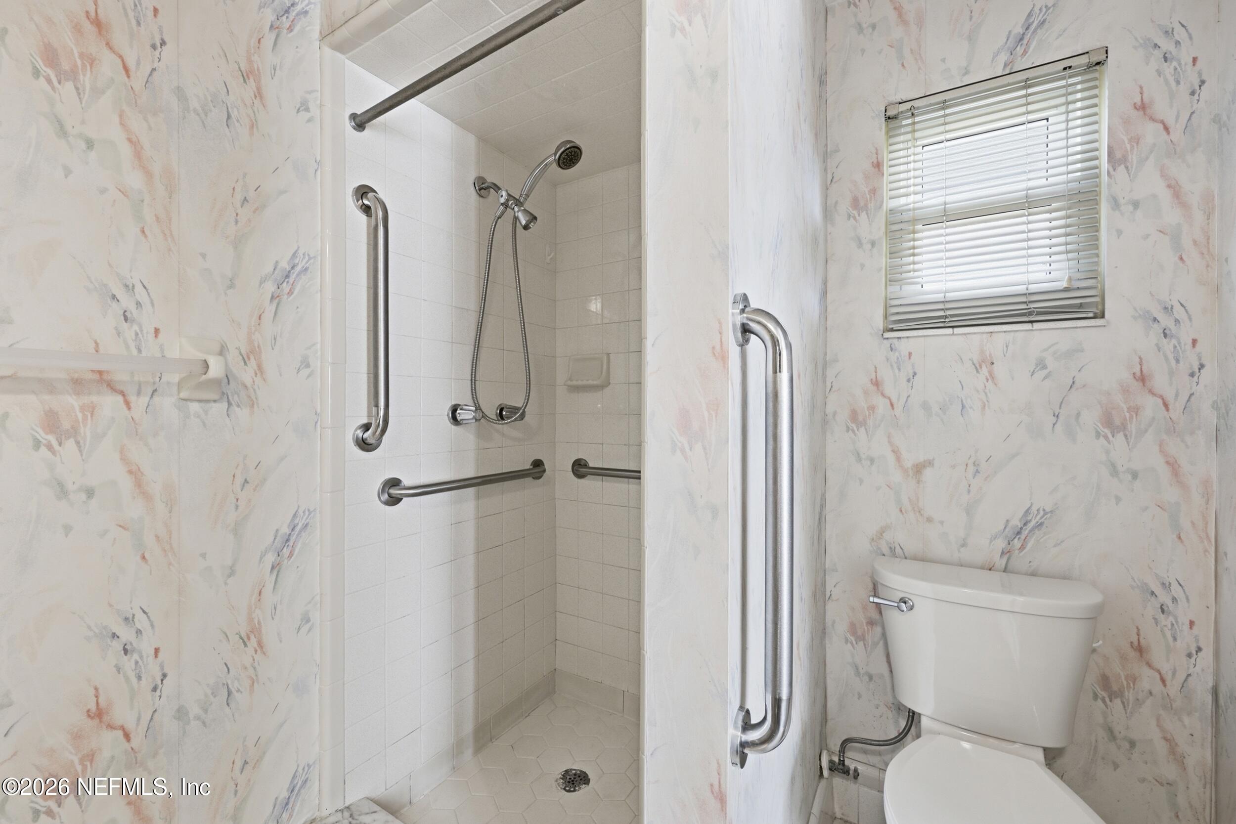 3519 Peoria Road Orange Park, FL 32065 - Photo 24 of 43 a bathroom with a toilet and a shower