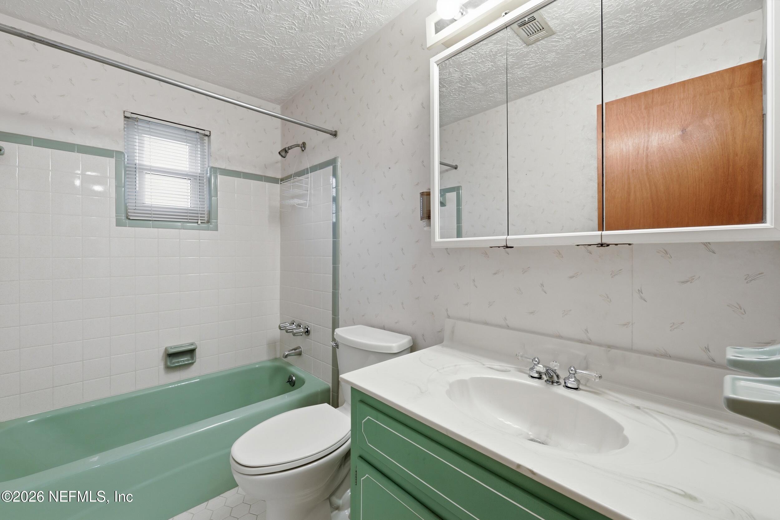 3519 Peoria Road Orange Park, FL 32065 - Photo 30 of 43 a bathroom with a sink toilet tub and shower