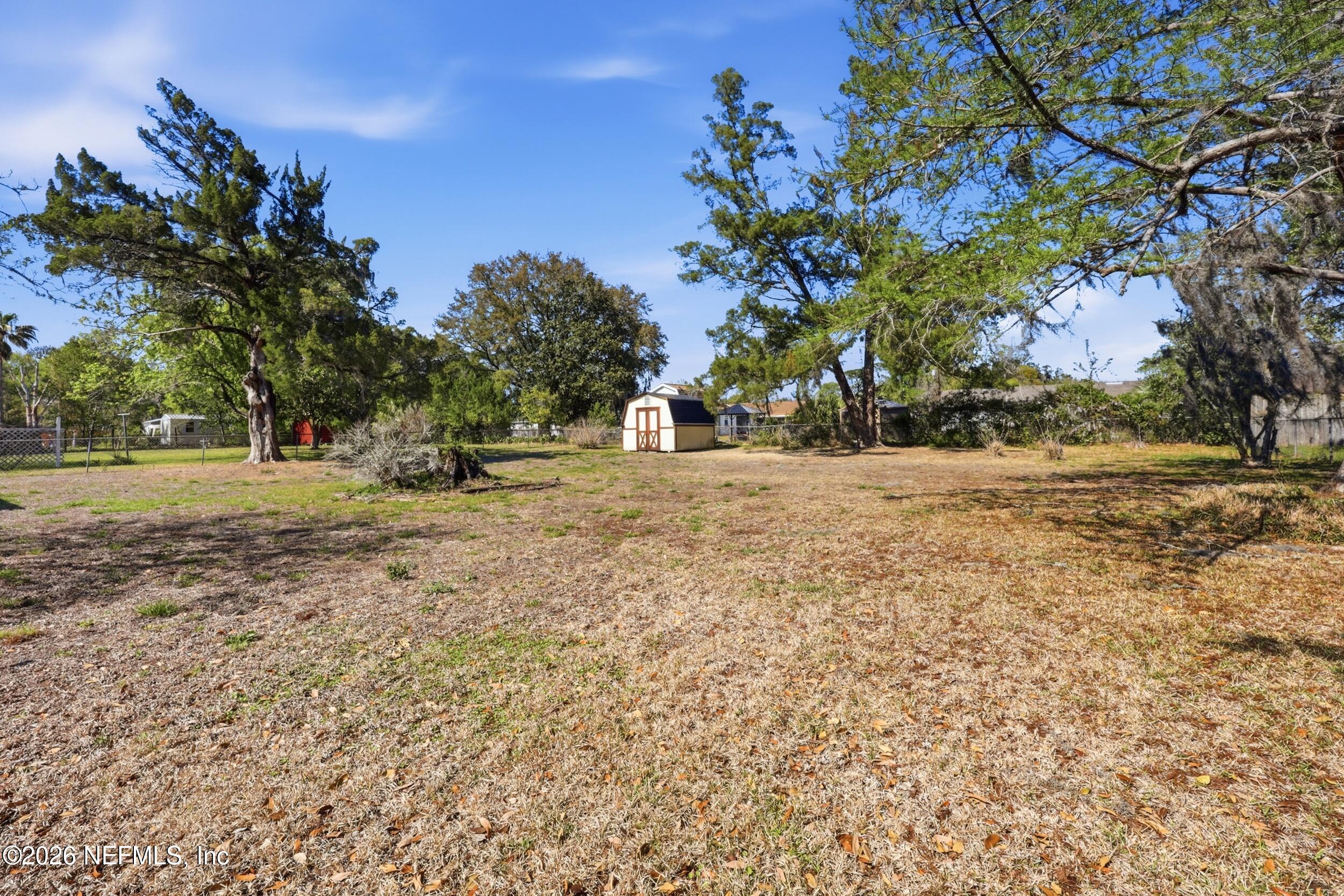 3519 Peoria Road Orange Park, FL 32065 - Photo 37 of 43 a view of dirt field with trees around