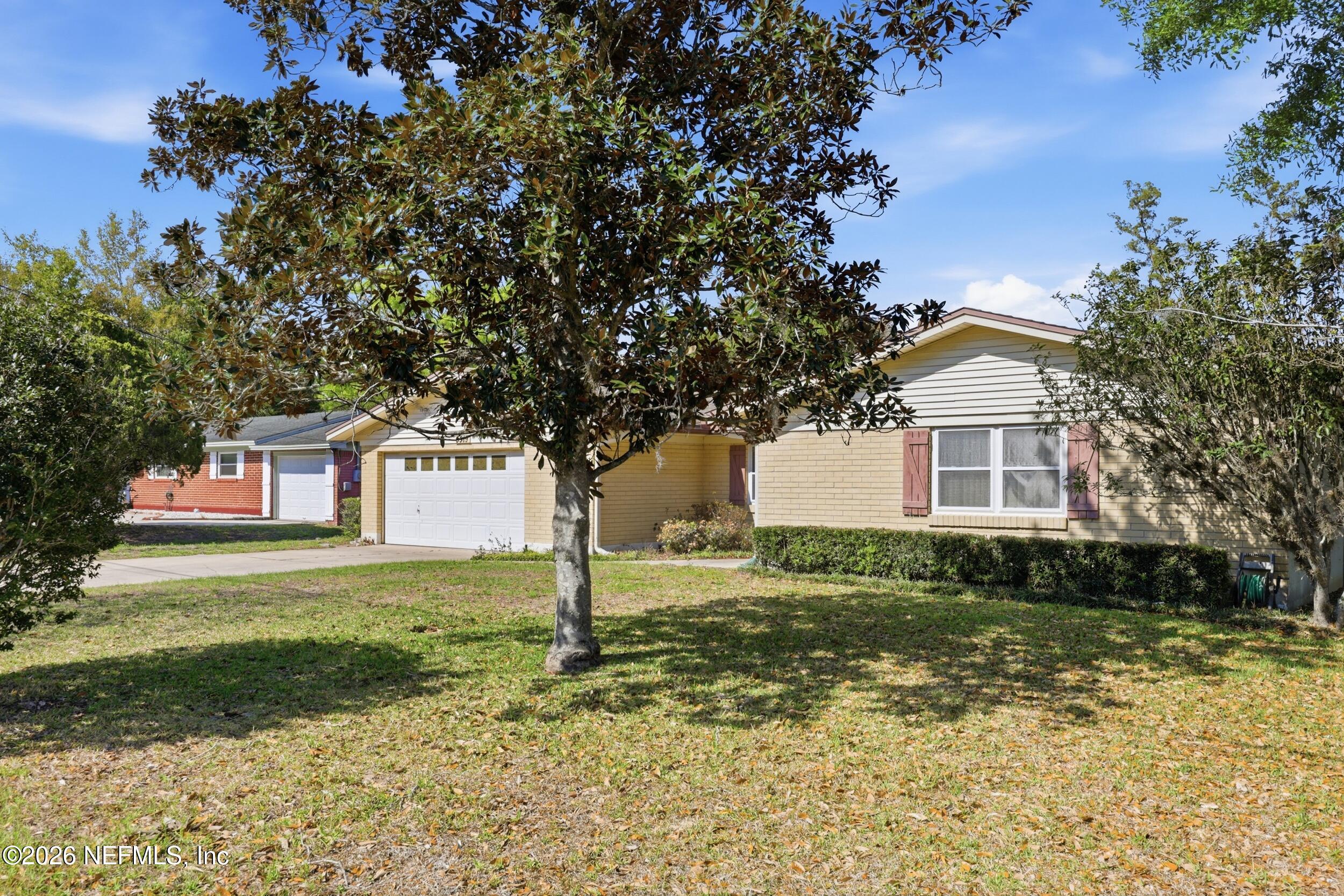3519 Peoria Road Orange Park, FL 32065 - Photo 40 of 43 a front view of a house with a yard