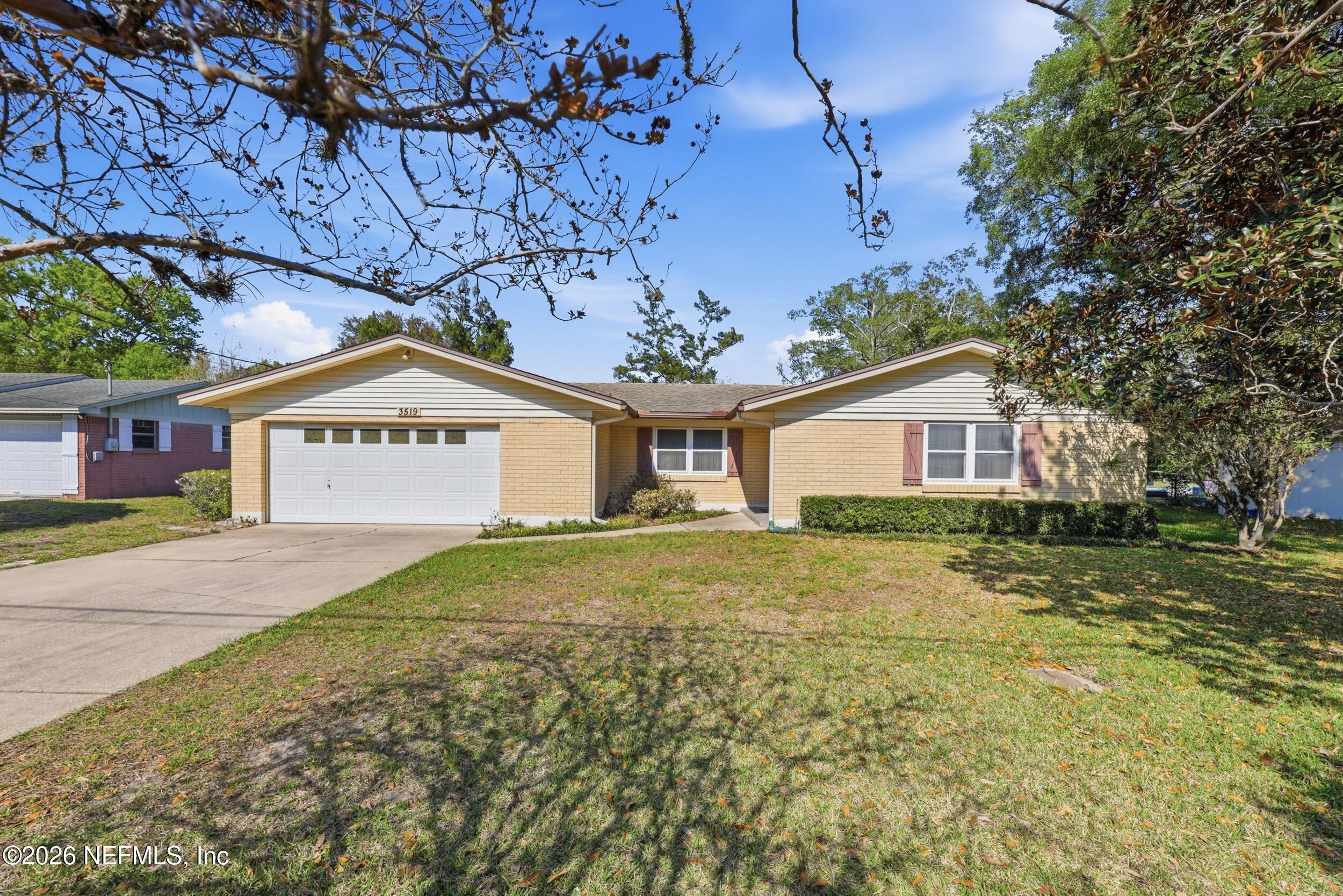3519 Peoria Road Orange Park, FL 32065 - Photo 42 of 43 a view of a house with a yard