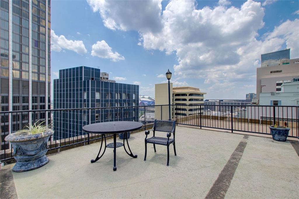 32 Peachtree Street Northwest, Unit 1102 Atlanta, GA 30303 - Photo 14 of 35 a view of a terrace with furniture and city view