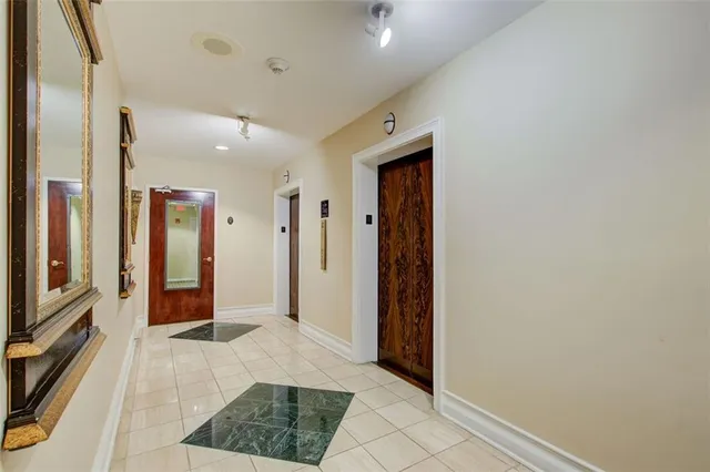 a bathroom with a sink mirror and toilet