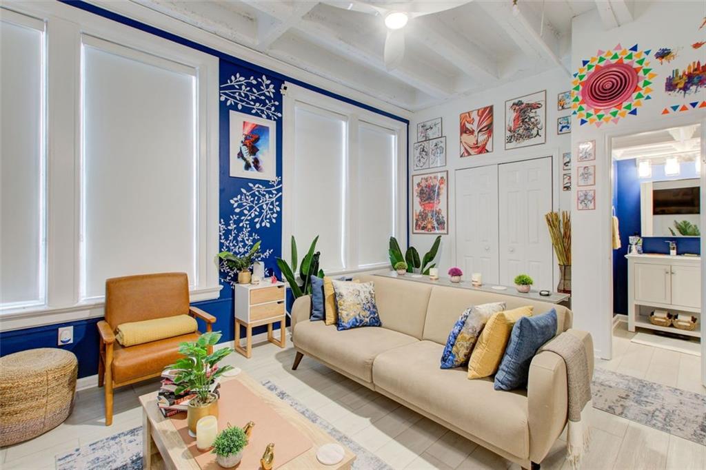 32 Peachtree Street Northwest, Unit 1102 Atlanta, GA 30303 - Photo 21 of 35 a living room with furniture and a couch