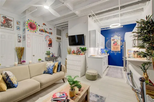 a kitchen with stainless steel appliances a sink a stove a microwave a sink and cabinets