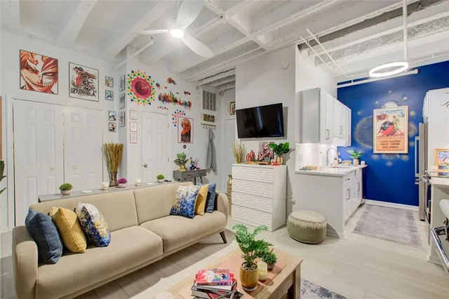a living room with furniture and a flat screen tv