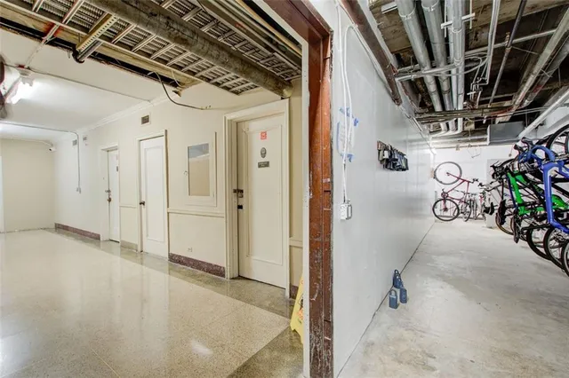 a view of a dining room with furniture and a large window