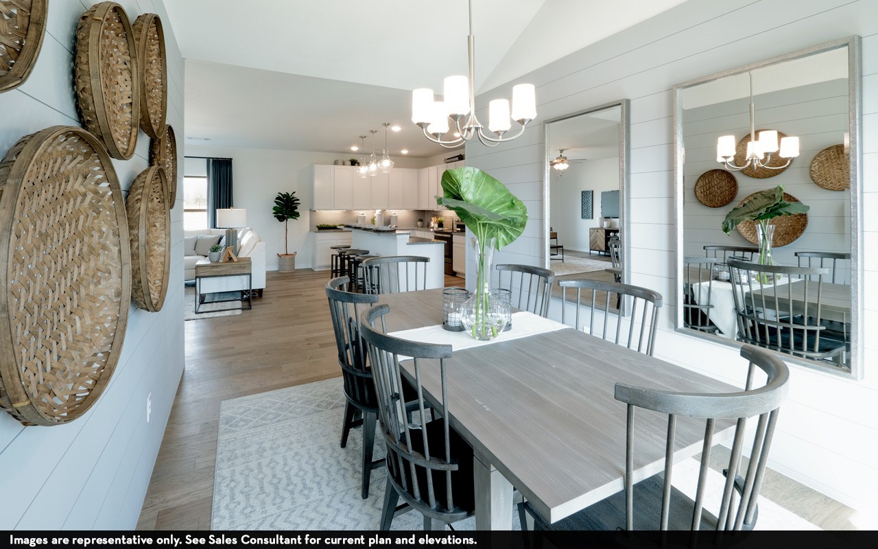 10669 Altitude Way Conroe, TX 77303 - Photo 13 of 20 a view of a dining room with furniture and wooden floor
